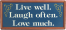 Live Well Laugh Often Love Much Sign with frame